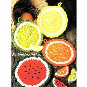 May include: Crochet pot holders shaped like fruit slices. The pot holders are in the colours of a lemon, orange, and watermelon. There are also smaller versions of the lemon and watermelon slices.