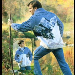 May include: A blue and white knitted sweater with a mountain scene design. The sweater has a high neck and a cable knit pattern on the sleeves. The model is wearing blue jeans and holding a stick.