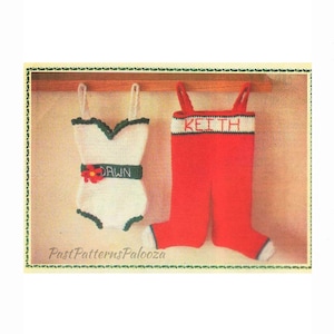 May include: A vintage knitting pattern for two crocheted Christmas stockings. One stocking is white with a green trim and the name "Dawn" embroidered on the belt. The other stocking is red with a white trim and the name "Keith" embroidered on the waistband.