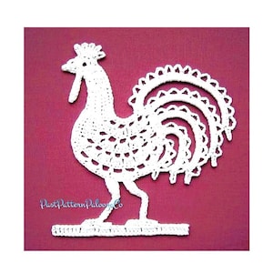 May include: White crocheted rooster with a detailed tail and a base. The rooster is on a pink background.