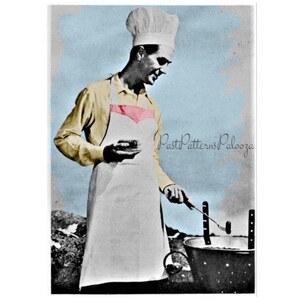 May include: A man wearing a white chef's hat and a white apron with a pink trim is cooking over a grill. He is holding a spatula in his right hand and a small bowl in his left hand. The background is a light blue sky.