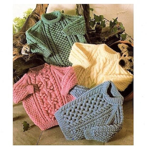May include: Four knitted sweaters in different colors and patterns. The sweaters are green, pink, cream, and blue. They are all made with a cable knit stitch.