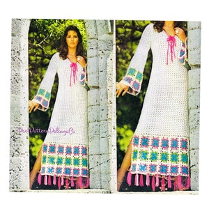 May include: A white crochet maxi dress with a V-neckline and long sleeves. The dress has a crocheted square pattern with pink, blue, and green accents. The dress has a side slit and a fringe trim at the hem.