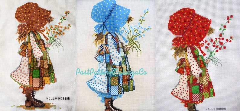 May include: Three cross-stitch patterns of a girl in a dress with a patchwork design, holding flowers. The girl is wearing a different colored bonnet in each pattern: brown, blue, and red.