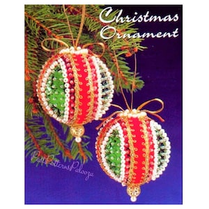 May include: Two beaded Christmas ornaments with green, red and gold accents. The ornaments are hanging from a pine tree branch. The text "Christmas Ornament" is printed at the top of the image.