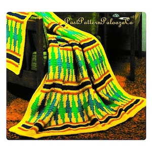 May include: A vibrant, handmade crochet blanket with a geometric pattern. The blanket features a yellow base with green, blue, orange, and black accents. The blanket is draped over a wooden chair. The text "Past Pattern Palooza Co" is visible.