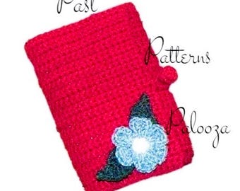 May include: A red crocheted notebook cover with a blue flower and green leaves. The cover has a button closure and the text "Past Patterns Palooza" is visible.