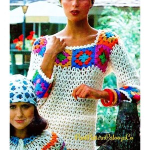 May include: A cream-colored crochet sweater with colorful square accents on the chest and sleeves. The sweater has long sleeves and a scoop neckline. The image also shows a matching crochet hat and colorful bracelets. The style is reminiscent of the 1970s.