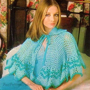 May include: A crocheted cape with a collar and tie closure. The cape is a light blue color with a darker blue trim. The cape is shown being worn by a woman with long blonde hair.