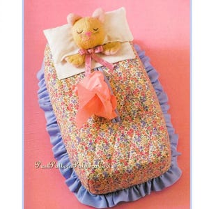 May include: A white ceramic mug with a black handle and the text "But First, Coffee" in a black, bold font. The mug is sitting on a wooden surface. The mug is approximately 4 inches tall.