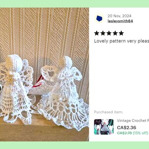 May include: Three white crocheted angel ornaments with delicate lace details. The angels are displayed on a shelf with a white background. The image includes a customer review that reads "Lovely pattern very pleased with it".