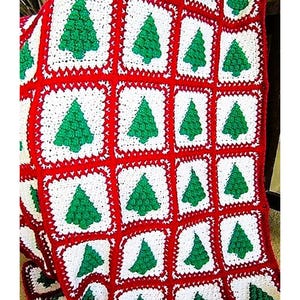 May include: A crocheted blanket with a red, white, and green color scheme. The blanket is made up of squares with green Christmas trees in the center.