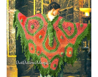 May include: A handmade crochet shawl in a butterfly design. The shawl features a vibrant color palette of red, green, and orange. The text "PastPatternPaloozaCo" is visible on the bottom left of the image. The shawl is worn over a green dress.