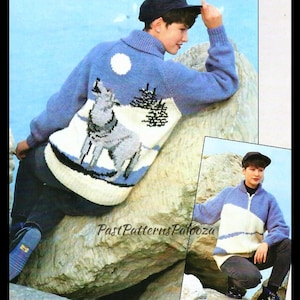 May include: A blue and white knitted sweater with a wolf design. The sweater has a high collar and a zipper closure. The model is wearing the sweater with black pants and a black cap.