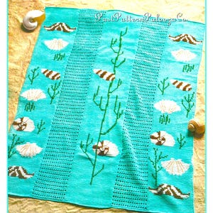 May include: A turquoise crochet blanket with a sea life design. The blanket features seashells, seahorses, and coral. The text "Crochet Pattern Galaxy Co." is in the upper right corner of the blanket.