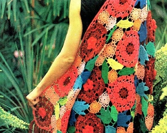 May include: A colorful crochet shawl with a floral design. The shawl is made with a variety of bright colors, including red, orange, yellow, green, blue, and purple. The shawl has a fringe border.
