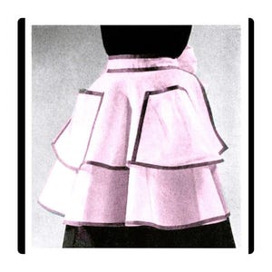 May include: A vintage-style, light pink skirt with a layered design. The skirt features dark trim outlining each layer and a bow detail at the back. The skirt is part of a fashion ensemble.