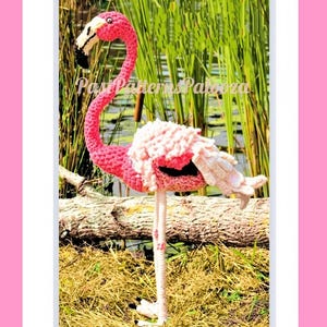 May include: A crocheted flamingo figure with a long, curved neck, a pink body, and white textured wing feathers. The bird has a black and white beak and stands on one thin leg. The text Past Patterns Palooza is visible across the center.