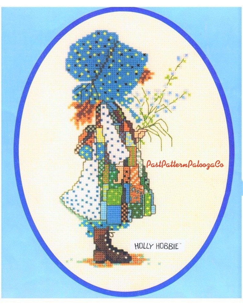 May include: Cross stitch pattern featuring a girl in a blue and white dress holding a bouquet of flowers. The pattern is titled "Holly Hobbie" and is from PastPatternPaloozaCo.