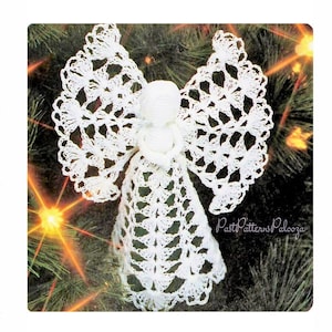 May include: A white crochet angel ornament with openwork wings and a flowing gown. The angel has a simple head and a heart-shaped detail at the chest. The background is a blurred image of a Christmas tree.