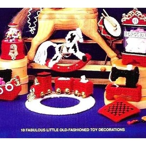 May include: Ten handmade felt toy decorations, including a rocking horse, a popcorn machine, a sewing machine, a train, a gumball machine, and a boat. The toys are all red and black with white accents.