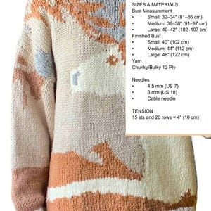 May include: A knit sweater featuring a multi-colored abstract pattern in shades of tan, brown, and light blue. The garment has a high ribbed collar and long sleeves. Text on the image lists sizes, yarn type, needle sizes, and tension measurements.
