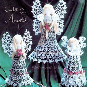 May include: Three crocheted angels in white with pink accents. The angels are of different sizes and are arranged in a pyramid shape. The largest angel is in the center and the smallest angel is on the right. The angels are all wearing white dresses and have white wings. The angels are all holding pink flowers in their hands. The text "Crochet Lacy Angels" is at the top of the image.