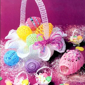 May include: A crocheted Easter basket filled with colorful crocheted eggs. The basket is decorated with a pink ribbon and is surrounded by smaller crocheted baskets filled with candy.