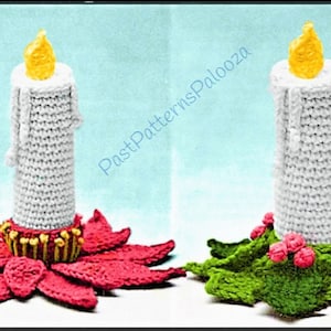 May include: Two crocheted candle decorations. One candle is on a red poinsettia base, the other is on a green holly base. Both candles have a yellow flame.