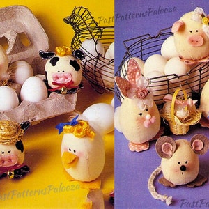 May include: A collection of handmade Easter egg ornaments featuring farm animals. The ornaments are made from fabric and have a variety of colours and patterns. The ornaments are displayed in a carton and a wire basket.