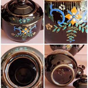 May include: A vintage brown ceramic teapot with a lid, featuring hand-painted floral and scroll designs in blue, orange, and teal. The teapot has a gold trim and is marked "JAPAN" on the bottom.