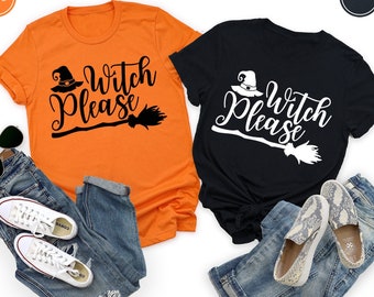 May include: Two t-shirts with the text "Witch Please" and a witch's hat and broom graphic. One shirt is orange and the other is black.