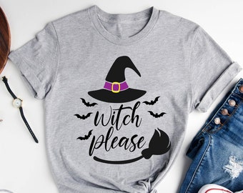 May include: A light grey t-shirt with a black witch hat, bats, and the text "witch please" with a black broom.