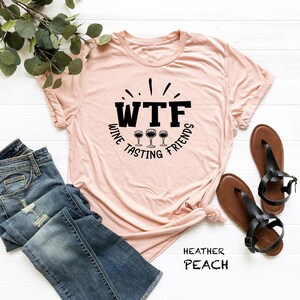 a women's t - shirt with the words wtf and three glasses of