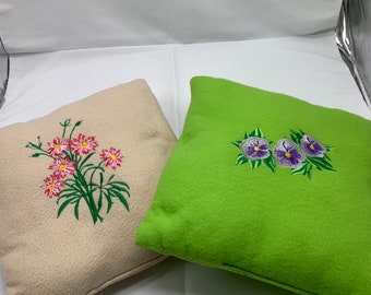 Embroidered handmade pillows in beige and green