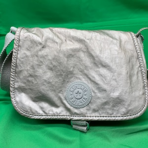A Kipling shoulder bag in a shiny silver.