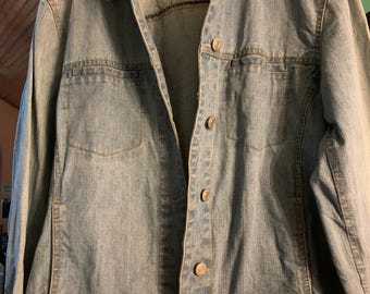 A sweet decorated jean jacket in a size large.