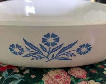 A CorningWare, blue Cornflower 1 quart casserole dish.