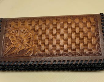 Hand tooled leather wallet with flower.