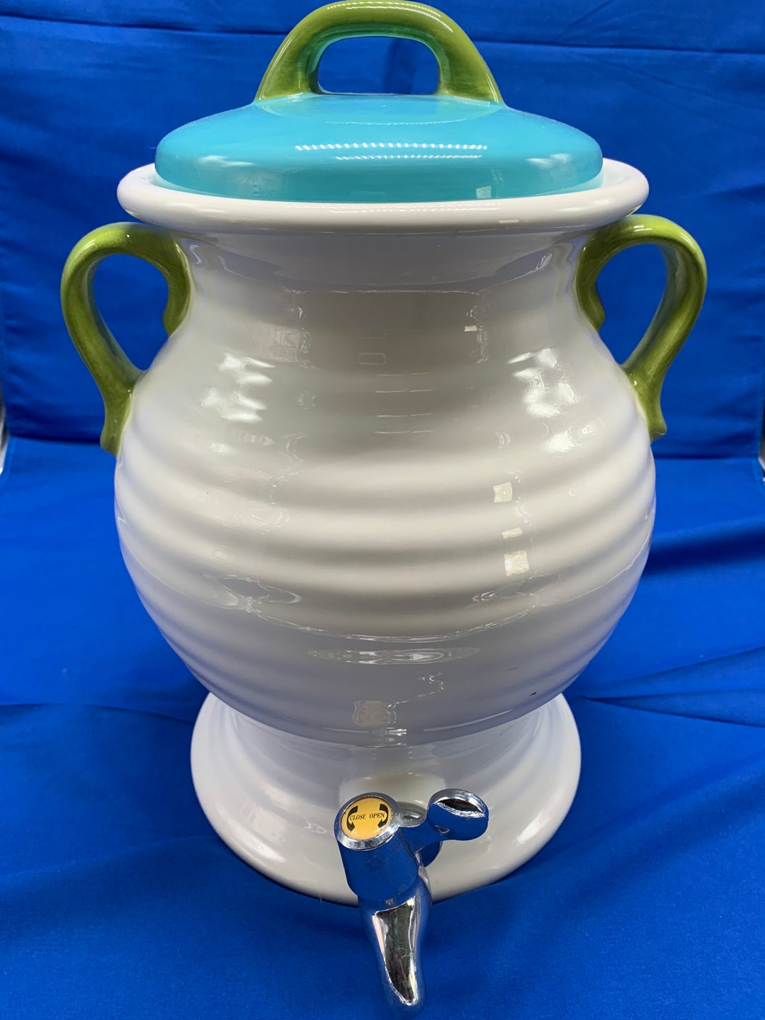 A Large Ceramic Beverage Dispenser in Cream, Olive Green and Turquoise