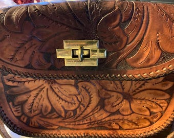 Vintage handbag with hand tooled flowers.