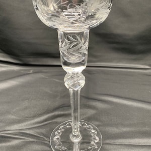 A single crystal clear candlestick holder by Rogaska.