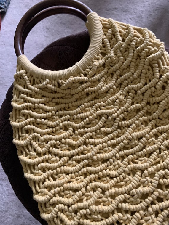 A macrame, two wood handled bag from the 70’s.