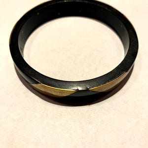 Wood and brass inlay bracelet from India.