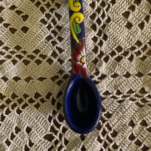 Blue and flowered deep spoon from Mexico.