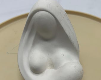 A plaster sculpture of the Madonna and child.