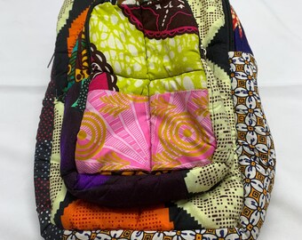 An African, patchwork- like backpack for kids.