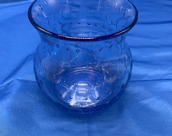 A blown glass bowl/vase with bubbles in blue.