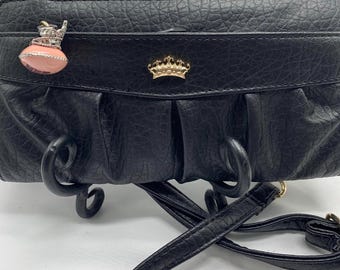 A “juicy couture “, crossbody/wallet with charm.