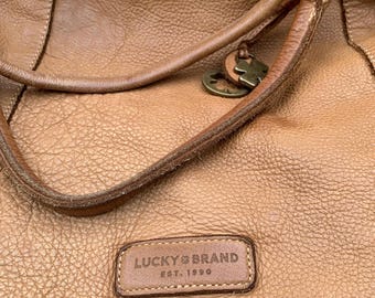 A large, leather “Lucky Brand”, shoulder/tote bag.